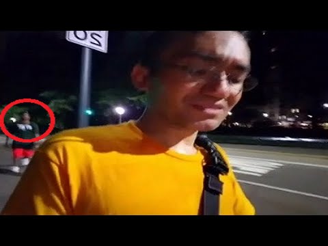 The mugger comes from behind RickeyBot films his own mugging